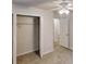 Spacious bedroom featuring a closet, carpet floors, and a ceiling fan at 5574 Oak Grove Dr, Acworth, GA 30102