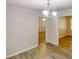 Dining area featuring neutral walls, vinyl plank flooring, and modern lighting at 5574 Oak Grove Dr, Acworth, GA 30102