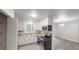 Bright eat-in kitchen featuring white cabinets, modern appliances, and updated countertops at 5574 Oak Grove Dr, Acworth, GA 30102