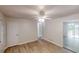 Bright living area with light walls, vinyl plank flooring, and access to the deck at 5574 Oak Grove Dr, Acworth, GA 30102