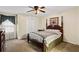 Serene bedroom with neutral walls, carpet flooring, and a large window at 812 Manning Sw Way, Marietta, GA 30064