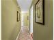 Inviting hallway with tile floors and neutral paint, enhanced by decorative wall art at 812 Manning Sw Way, Marietta, GA 30064