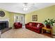 Comfortable living room featuring a cozy fireplace, plush seating, and natural light at 812 Manning Sw Way, Marietta, GA 30064