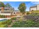 Backyard featuring a swimming pool and patio area with attractive brick landscaping and a well-maintained lawn at 828 Jami Ct, Lawrenceville, GA 30046