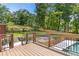 Multi-tiered backyard with retaining walls, swimming pool, and wood deck at 828 Jami Ct, Lawrenceville, GA 30046
