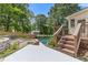 Swimming pool with adjacent patio and backyard with stairs and deck at 828 Jami Ct, Lawrenceville, GA 30046