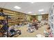 Messy unfinished basement with shelving, decorations, and beige carpet at 828 Jami Ct, Lawrenceville, GA 30046
