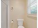 Bathroom features a toilet and shower, offering essential functionality at 828 Jami Ct, Lawrenceville, GA 30046