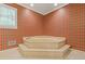 Stylish bathroom featuring a large tub for ultimate relaxation and a decorative aesthetic at 828 Jami Ct, Lawrenceville, GA 30046