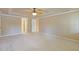 Spacious carpeted bedroom with trey ceiling and ceiling fan at 828 Jami Ct, Lawrenceville, GA 30046