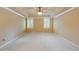 Spacious carpeted bedroom with neutral colors, trey ceiling, and bright windows at 828 Jami Ct, Lawrenceville, GA 30046