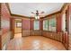 Dining room with plaid wallpaper, tile floors, and large windows offering abundant natural light at 828 Jami Ct, Lawrenceville, GA 30046
