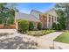 Two-story brick home with a spacious driveway and manicured landscaping at 828 Jami Ct, Lawrenceville, GA 30046