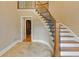 Elegant foyer with tiled flooring, staircase with wrought iron railing, and neutral wall colors at 828 Jami Ct, Lawrenceville, GA 30046