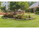Well-maintained flower bed with colorful blooms in the front yard of a beautiful home at 828 Jami Ct, Lawrenceville, GA 30046