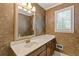 Cozy half bathroom with wallpaper, vanity, and classic fixtures at 828 Jami Ct, Lawrenceville, GA 30046