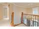 Hallway with decorative railing and lighting showcasing the architecture at 828 Jami Ct, Lawrenceville, GA 30046