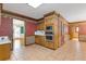Well-lit kitchen featuring tile floors, stainless steel appliances, and adjacent room access at 828 Jami Ct, Lawrenceville, GA 30046