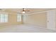 Bright main bedroom with carpet and natural light from windows, offering a serene retreat at 828 Jami Ct, Lawrenceville, GA 30046