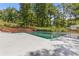 Relaxing pool with a spacious patio and beautiful trees at 828 Jami Ct, Lawrenceville, GA 30046