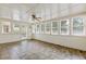 Bright sunroom filled with natural light, featuring tile floors and multiple windows at 828 Jami Ct, Lawrenceville, GA 30046