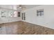 Well-lit sunroom with tile flooring, paneled walls, and ceiling fan at 828 Jami Ct, Lawrenceville, GA 30046