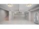 Finished basement with tile flooring, ceiling fan, and door at 953 Mystic Way, Hampton, GA 30228
