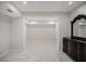 Open basement area featuring tile flooring and plenty of natural light at 953 Mystic Way, Hampton, GA 30228