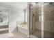 Bathroom features tiled shower, soaking tub, and window for great lighting at 953 Mystic Way, Hampton, GA 30228