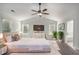 This virtually staged bedroom with bed, dresser, plants and decor to show style and potential at 953 Mystic Way, Hampton, GA 30228