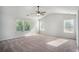 Bedroom with three windows to provide great light and a carpet for a comfortable place to unwind at 953 Mystic Way, Hampton, GA 30228