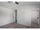 Bedroom with neutral carpet, ceiling fan, walk-in closet and view to the hallway at 953 Mystic Way, Hampton, GA 30228