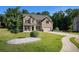 Beautiful two-story brick home with a well-manicured lawn, two-car garage, and inviting curb appeal at 953 Mystic Way, Hampton, GA 30228