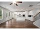 Bright kitchen featuring white cabinets, stainless steel appliances, and a center island at 953 Mystic Way, Hampton, GA 30228