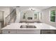 Open concept living room featuring stairs and view of the kitchen with an island at 953 Mystic Way, Hampton, GA 30228