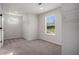 Walk-in closet provides ample storage space with carpeted floors and natural lighting at 953 Mystic Way, Hampton, GA 30228