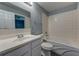 Bathroom with a white tiled shower-tub combo, vanity, and updated fixtures at 103 Chicamauga Sw Ave, Atlanta, GA 30314