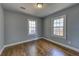 Bedroom with hardwood floors and two windows at 103 Chicamauga Sw Ave, Atlanta, GA 30314