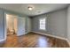 Bedroom features hardwood floors and attached bathroom at 103 Chicamauga Sw Ave, Atlanta, GA 30314