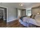 This bedroom features hardwood floors, and access to the bathroom and dining room at 103 Chicamauga Sw Ave, Atlanta, GA 30314