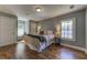 This bedroom features hardwood floors, a window seat, and neutral paint for a calming space at 103 Chicamauga Sw Ave, Atlanta, GA 30314