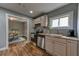 Functional kitchen with stainless steel appliances and a view into the dining area at 103 Chicamauga Sw Ave, Atlanta, GA 30314