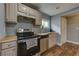 Well-appointed kitchen with stainless steel appliances and butcher block countertops at 103 Chicamauga Sw Ave, Atlanta, GA 30314