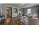 Cozy living room featuring hardwood floors, fireplace, and built-in bookshelves with neutral decor at 103 Chicamauga Sw Ave, Atlanta, GA 30314