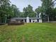 Spacious backyard featuring a deck, perfect for outdoor relaxation and activities at 1192 Sandalwood Dr, Lawrenceville, GA 30043