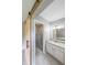 Beautiful bathroom showing the sliding barn door, vanity with granite countertop, and updated shower at 1192 Sandalwood Dr, Lawrenceville, GA 30043