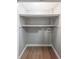 Walk-in closet with shelves and flooring, plus laundry hookups for stackable washer and dryer at 1192 Sandalwood Dr, Lawrenceville, GA 30043