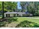 Charming single-story home with a well-manicured lawn and convenient carport at 1192 Sandalwood Dr, Lawrenceville, GA 30043