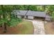 Inviting single-story home featuring a spacious front yard and convenient covered parking at 1192 Sandalwood Dr, Lawrenceville, GA 30043