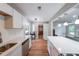 Bright kitchen with quartz countertops, a stainless sink, and plenty of cabinet space at 1192 Sandalwood Dr, Lawrenceville, GA 30043